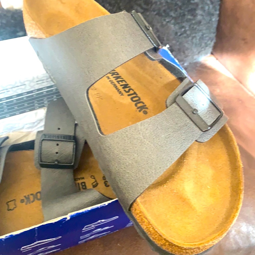 Brand new! Birkenstock gray with dark gray buckle. My son got two pairs for bday
